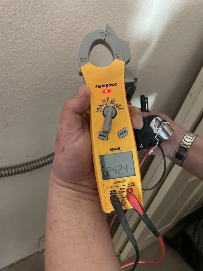 Voltage testing with clamp meter during Electrical Installation Services in Odessa